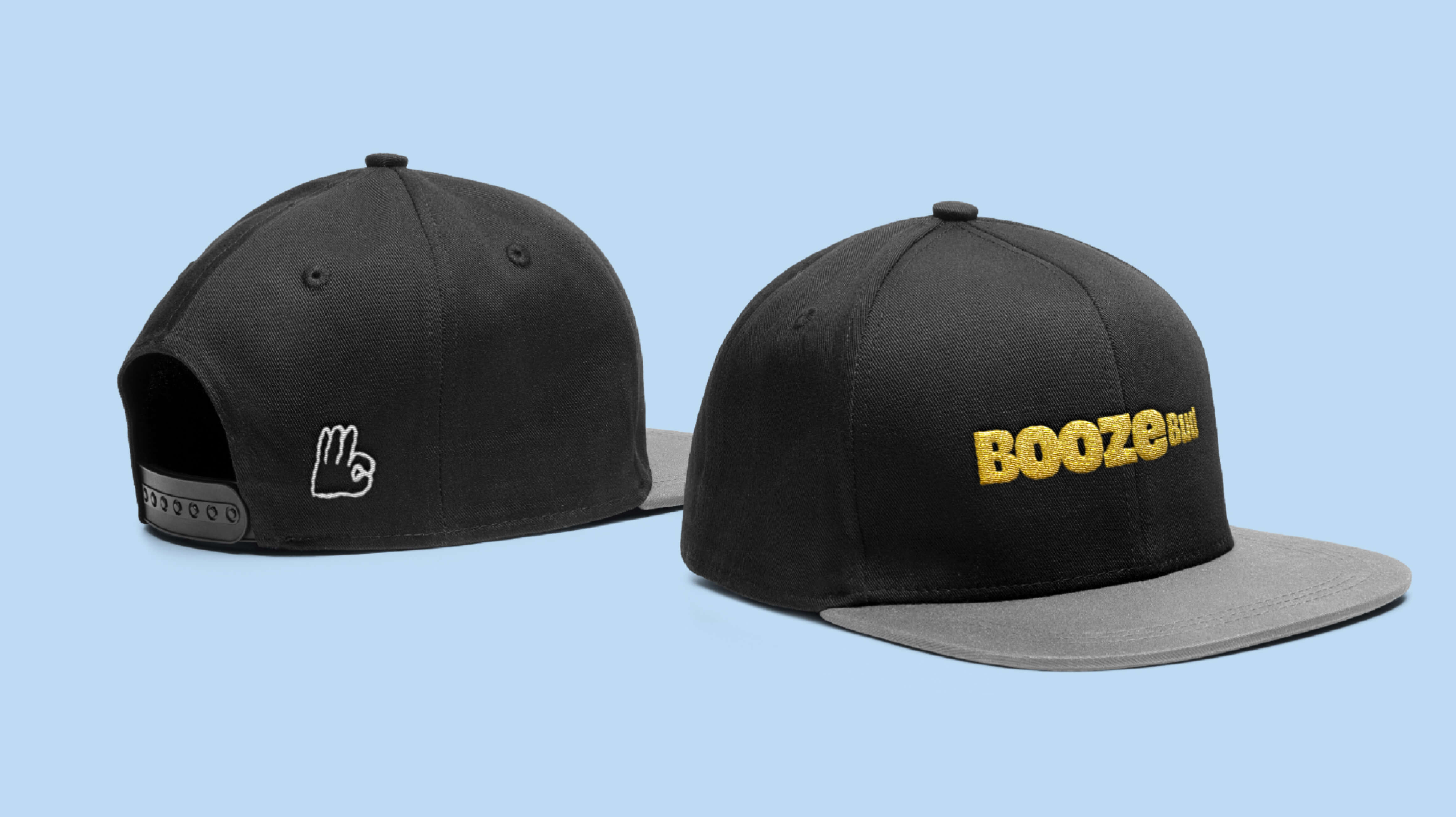 BoozeBud-branded bottle caps arranged in a pattern, featuring the wordmark and brand colours