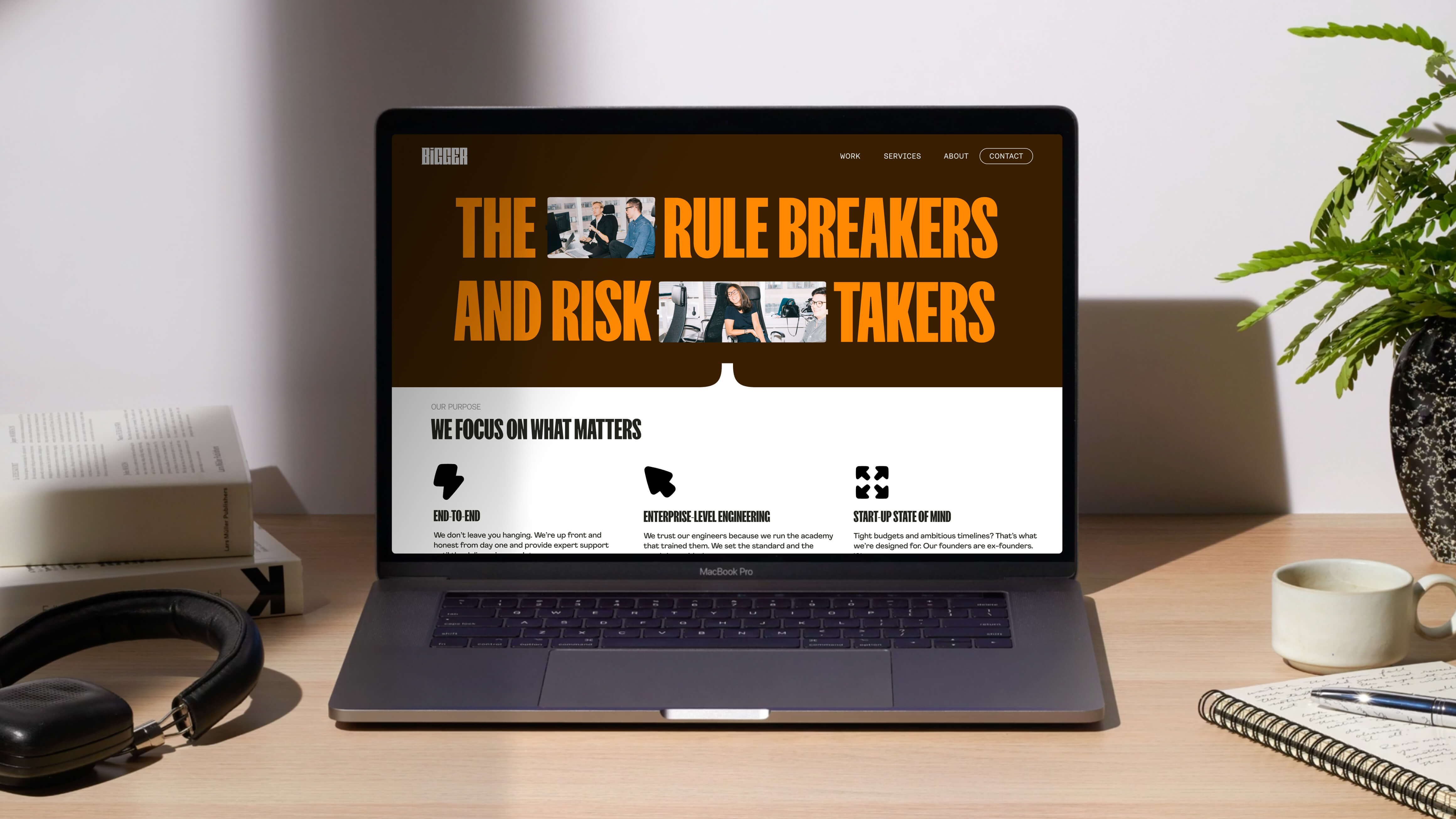 Bigger brand guidelines document displayed on a MacBook showing logo construction details