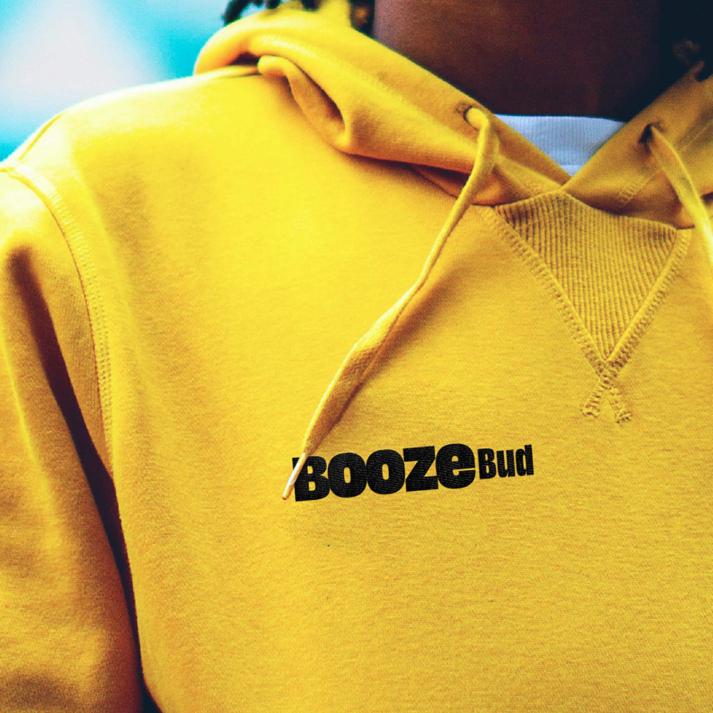 BoozeBud-branded hoodie in carbon black with the golden-yellow wordmark on the chest