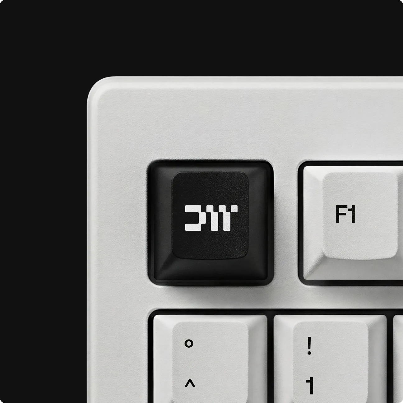 Close-up of a Dataweavers-branded keyboard key featuring the node-inspired DW lettermark