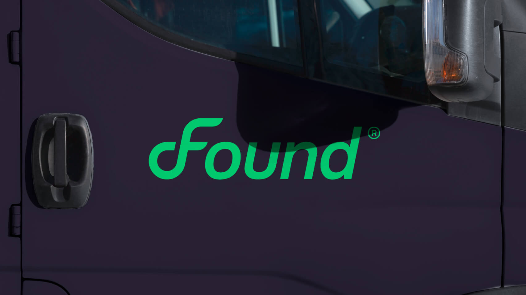 Found branded concrete truck showing the wordmark applied large across the mixer barrel