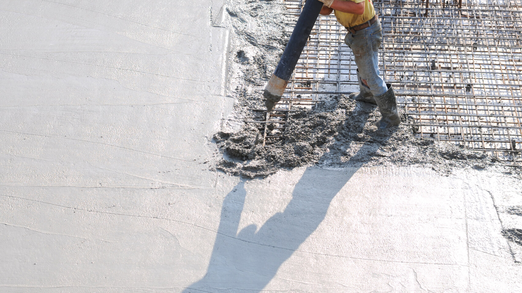 Found close-up product photograph showing freshly poured concrete with the brand wordmark