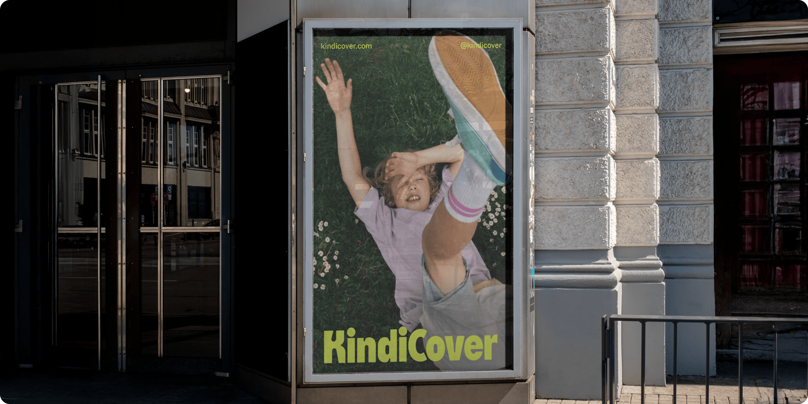 KindiCover K logomark inspired by a puzzle-board toy, shown large on a bright background