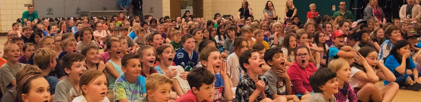 A large group of children in a gym.