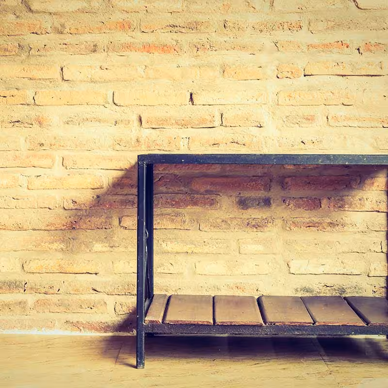 table next to a garage wall