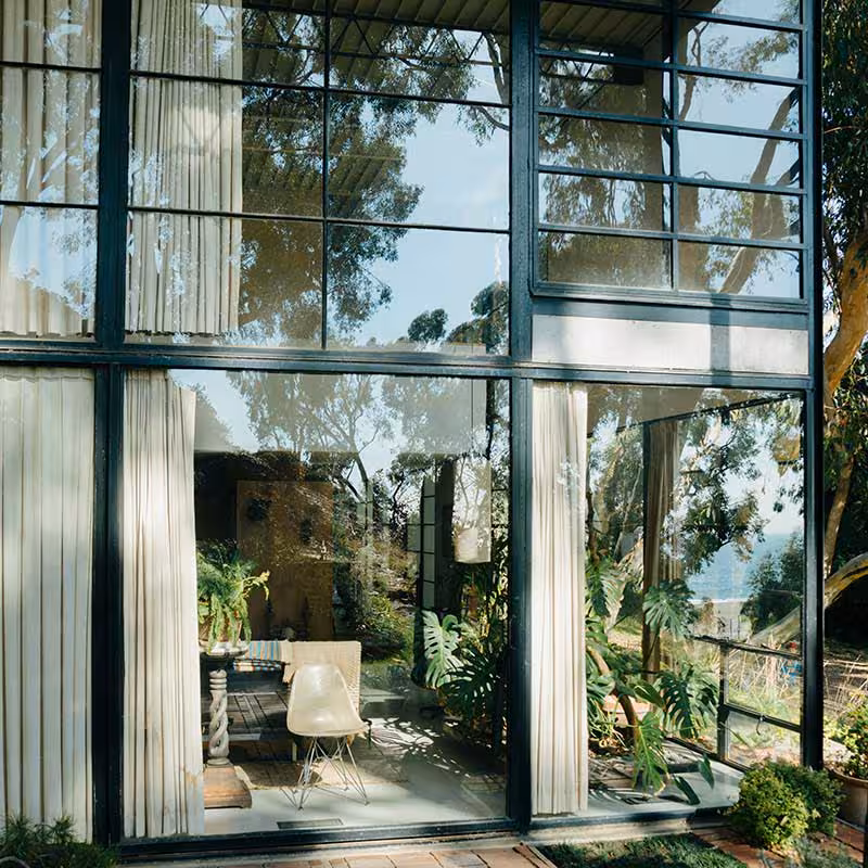 high ceiling conservatory with glass windows