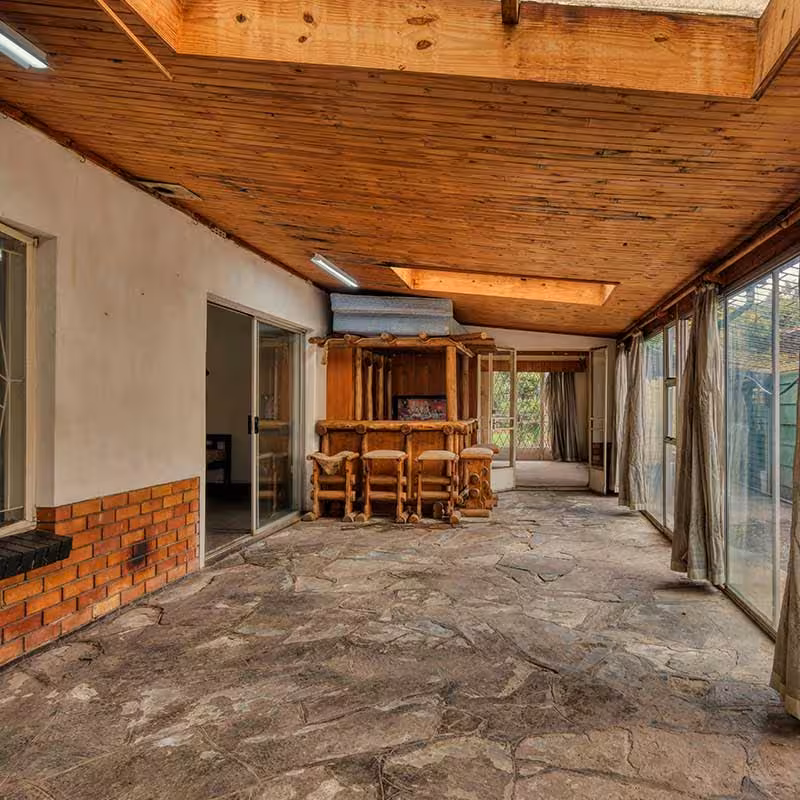 rustic wooden conservatory with slab flooring