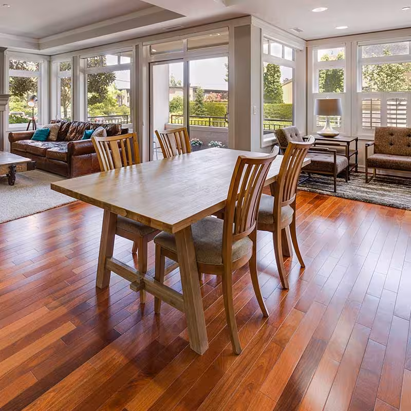 extension with hardwood flooring and table with chairs