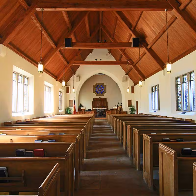 wooden church interior with benches