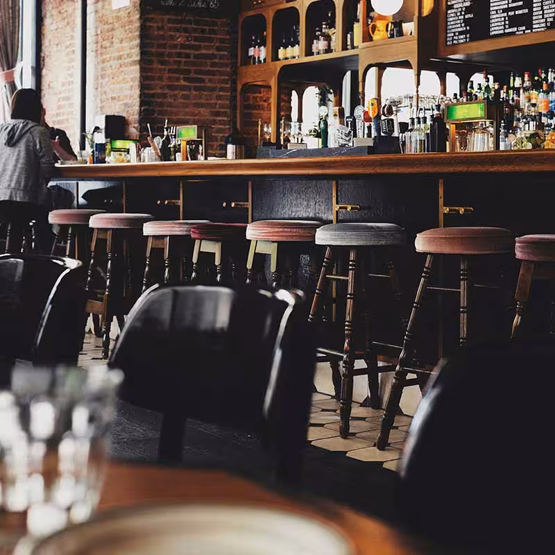people having drinks at a pub bar