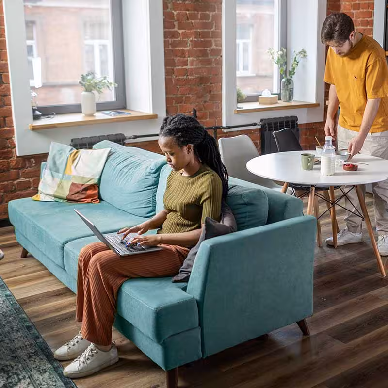 two people in a common area of a hmo