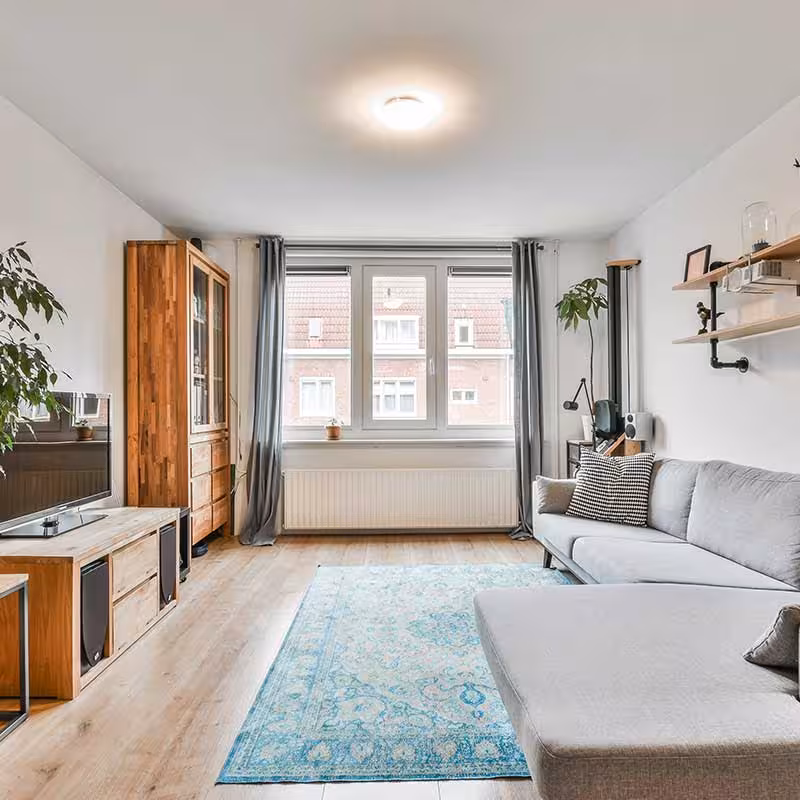 large room refurbished and redecorated, long view