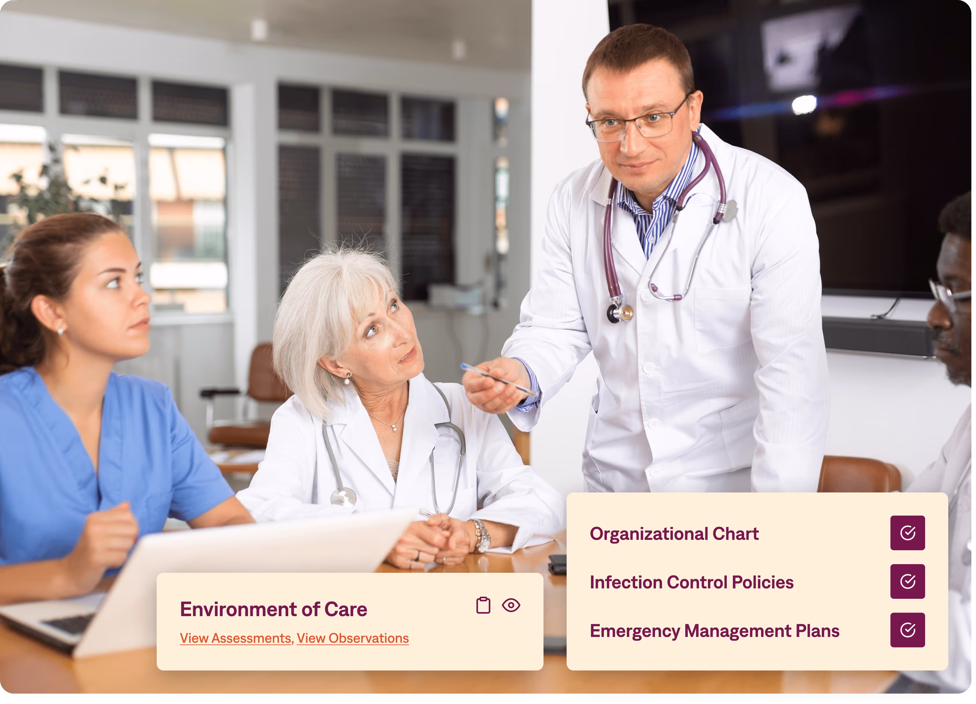 A group of doctors and nurses with a laptop on the table