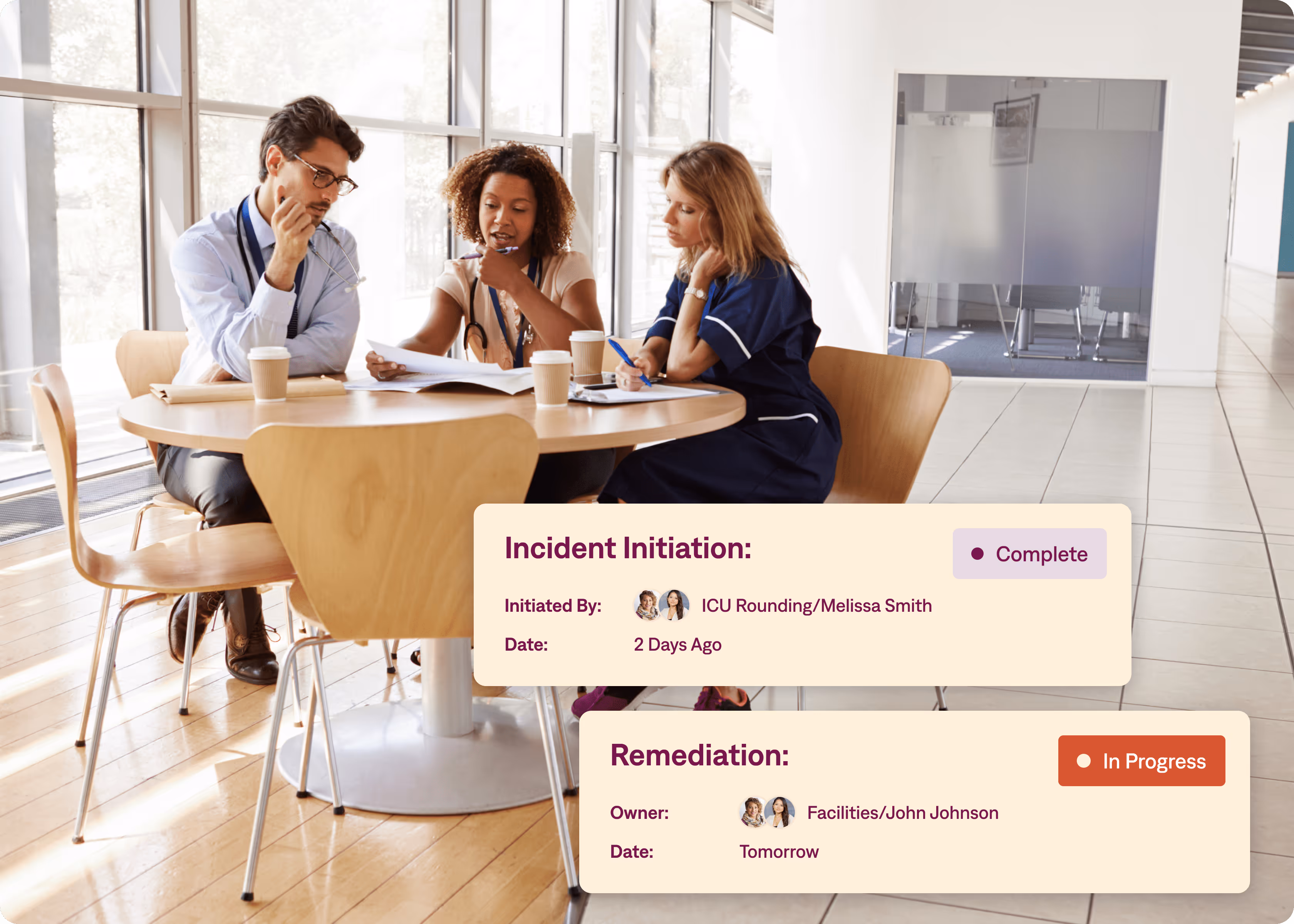 A group of people are sitting around a table looking at papers
