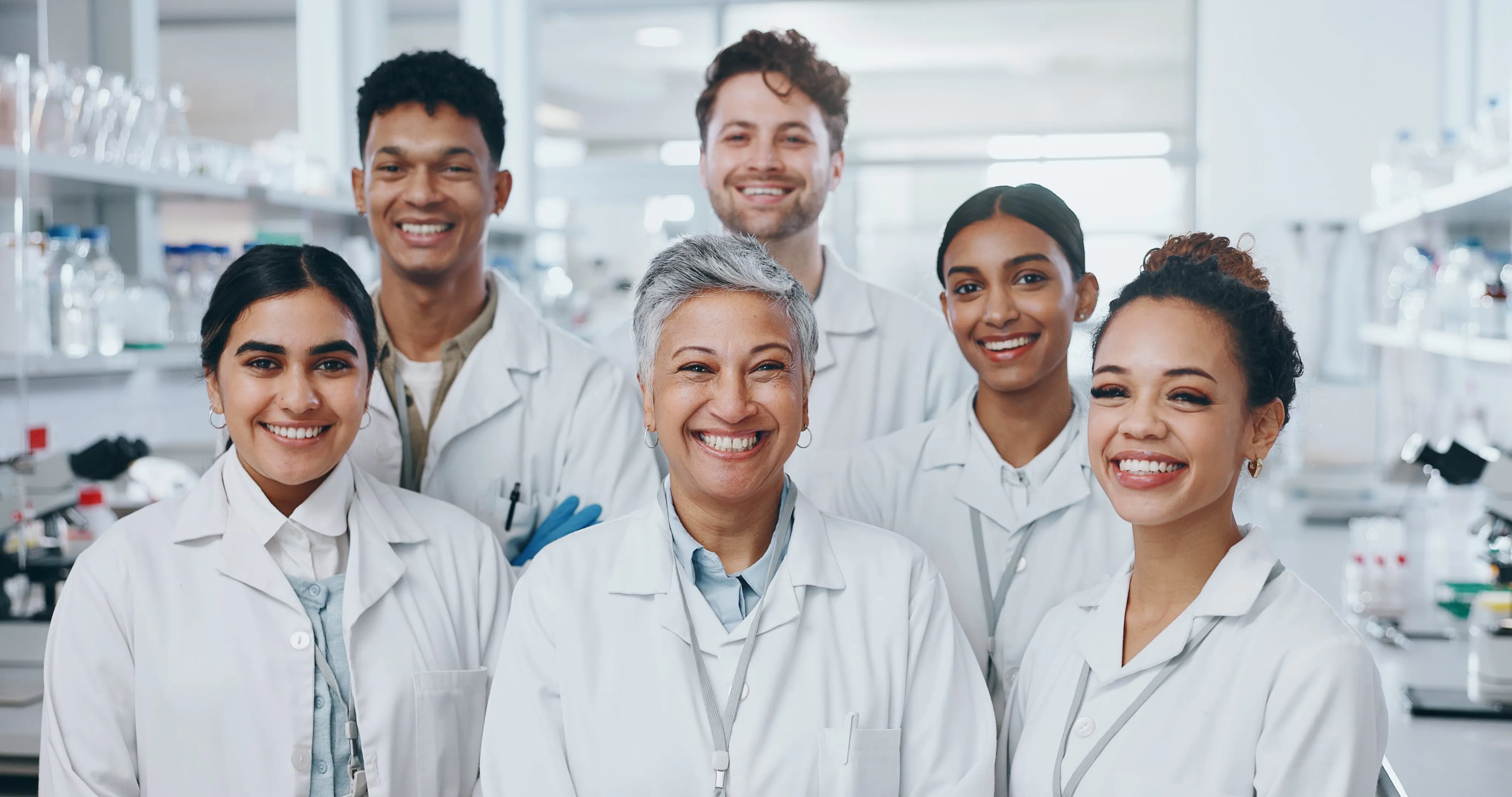A group of scientists posing for a picture in a lab