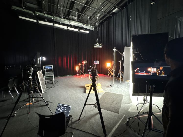 A Happy Productions sound stage built out with lighting grid, monitors and two cameras