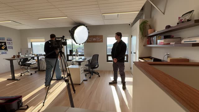 Behind the scenes on a Happy Productions interview set up in an office