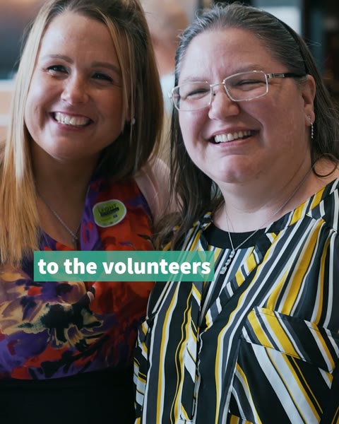 Two staff members of the Mental Health Association of Nebraska smiling on camera in a video thanking volunteers