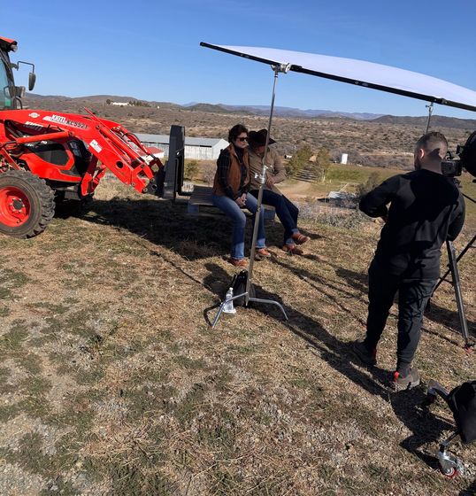 Happy Productions crew filming a couple on a ranch