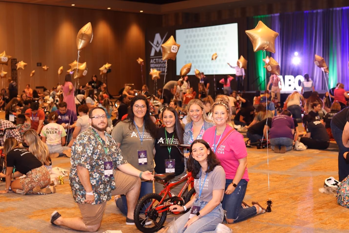 A group of people posing for a photoDescription automatically generated