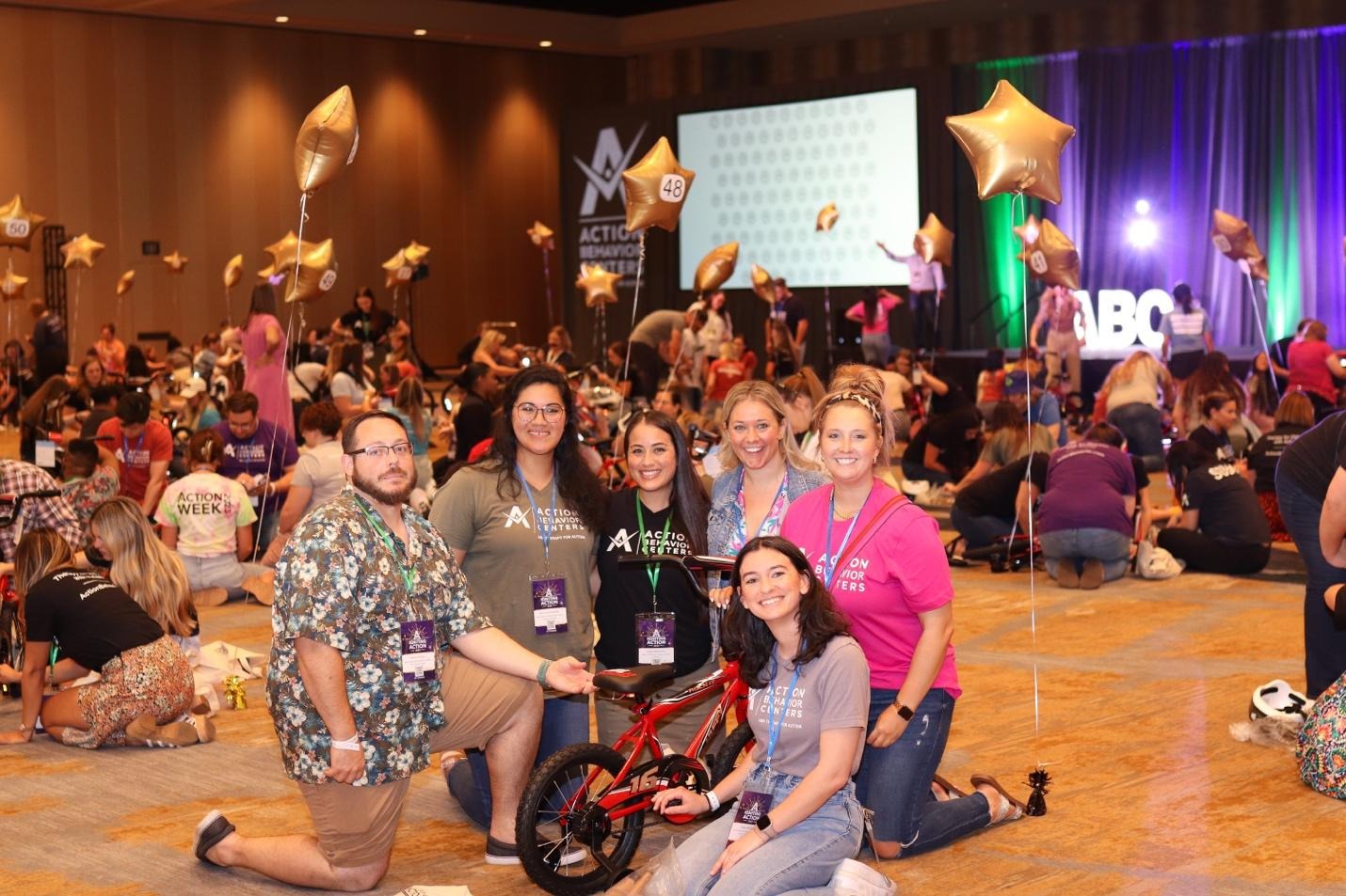 A group of people posing for a photoDescription automatically generated