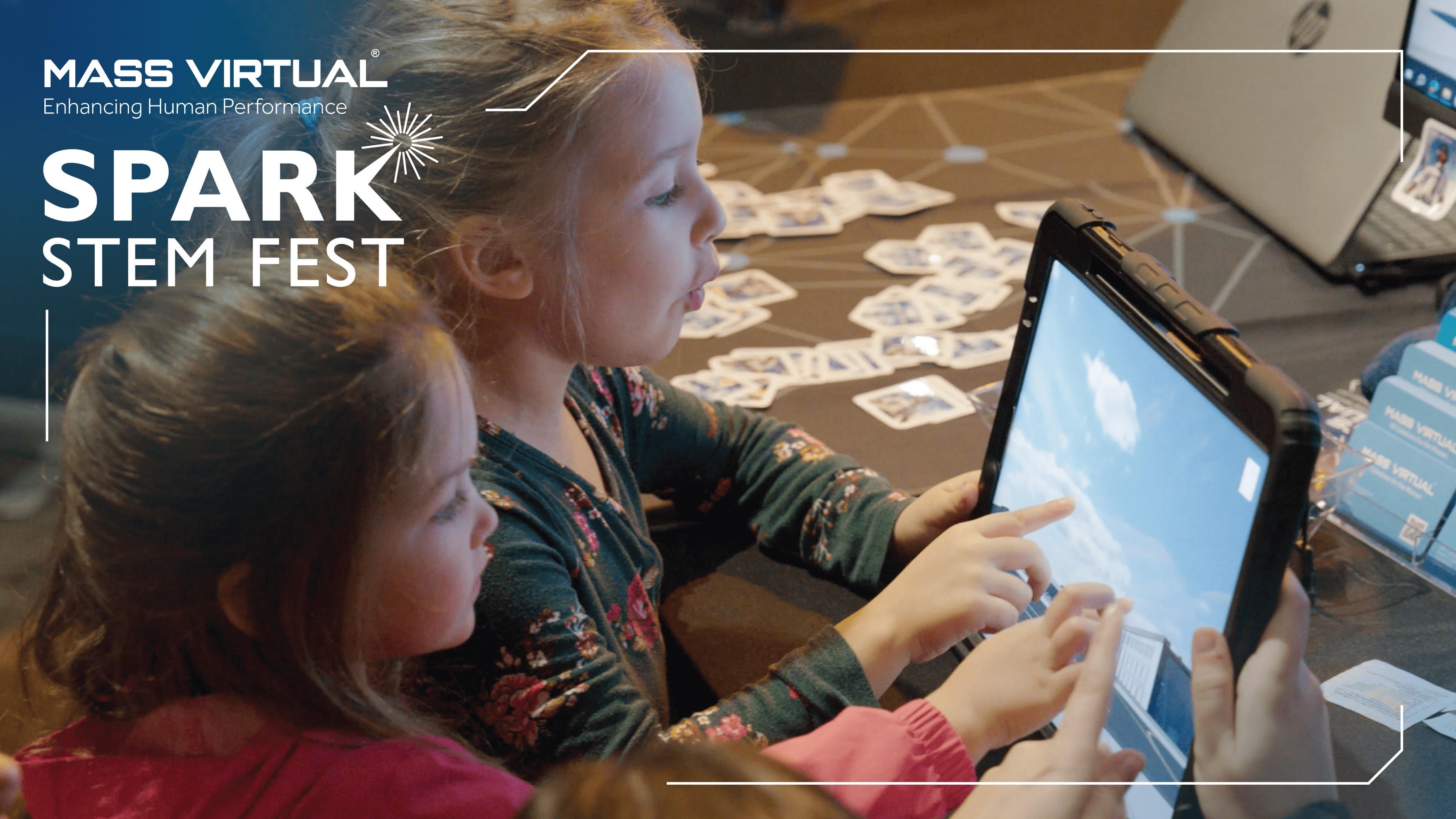 Children using a touchscreen at Spark STEM Fest.
