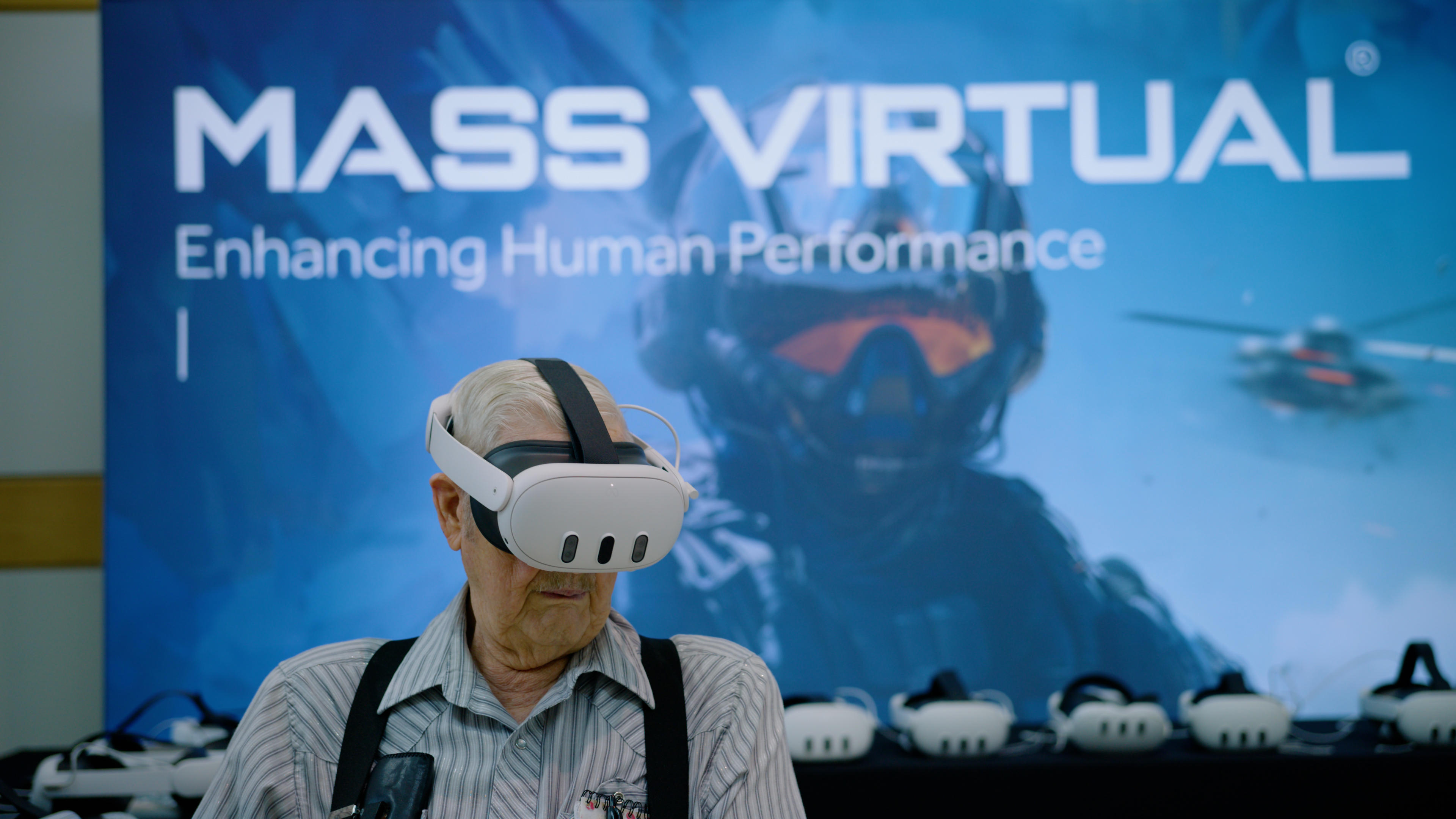 Mass Virtual graphic with a person wearing a VR headset.