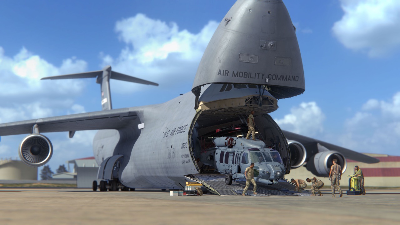 C-5 aircraft with its nose open on the flight line.