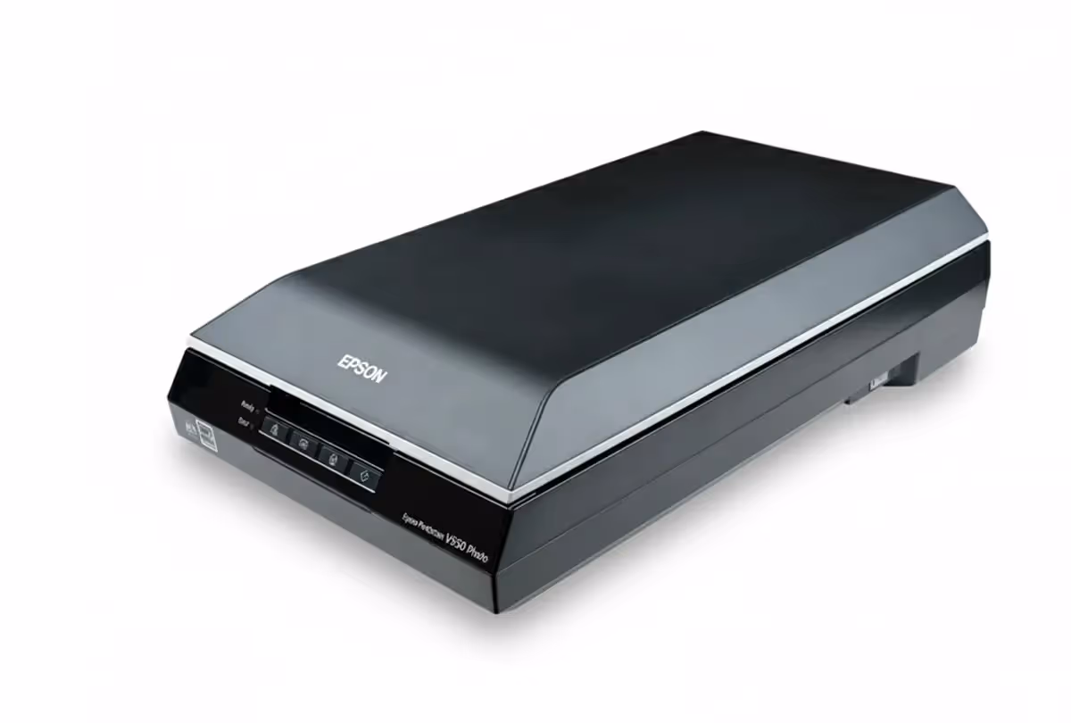Compact Epson V600 A4 scanner designed for photo, film, and document scanning, shown with transparency unit for slides and negatives.