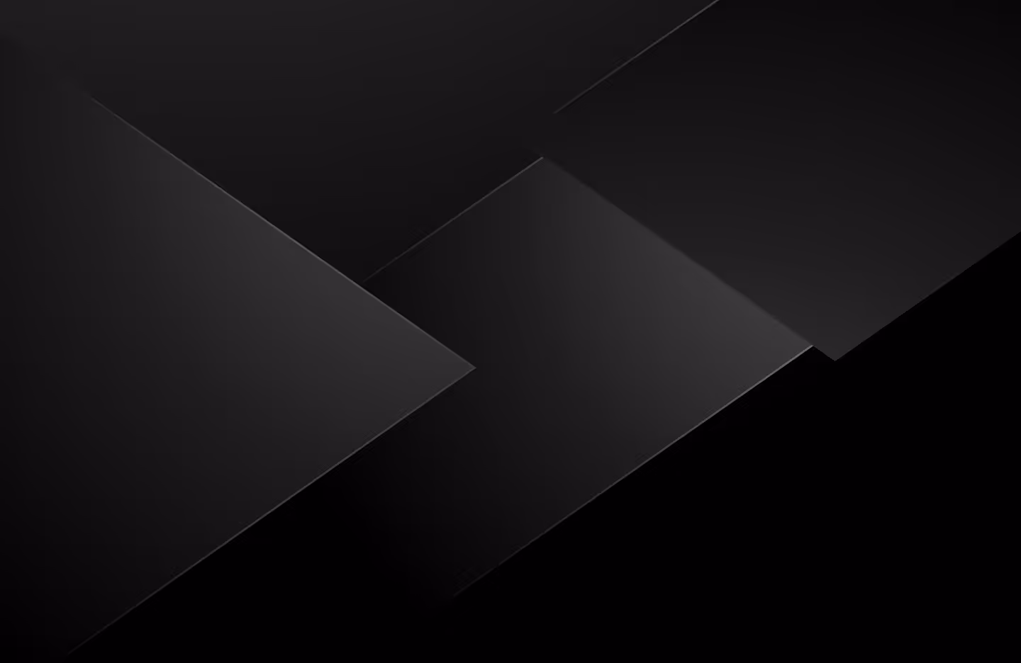 Abstract black layered geometric shapes with subtle gradients and shadows.