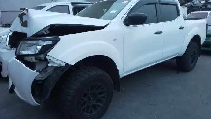 White damaged car with severe front-end damage ready for car removal and salvage in Melbourne for instant cash.