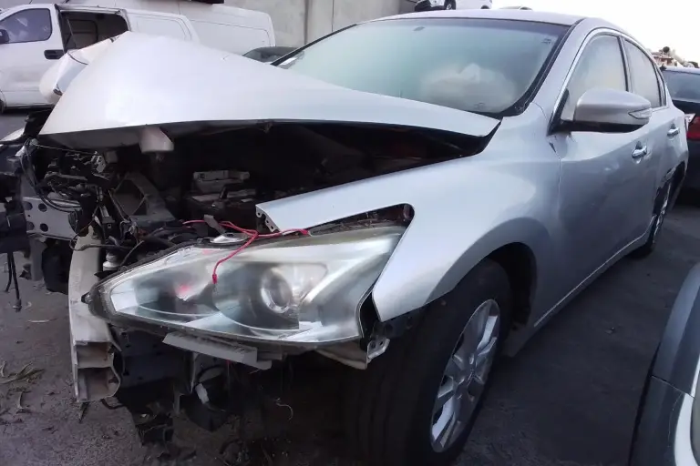 Silver wrecked car with structural damage available for cash for damaged cars and hassle-free car removal service in Melbourne.