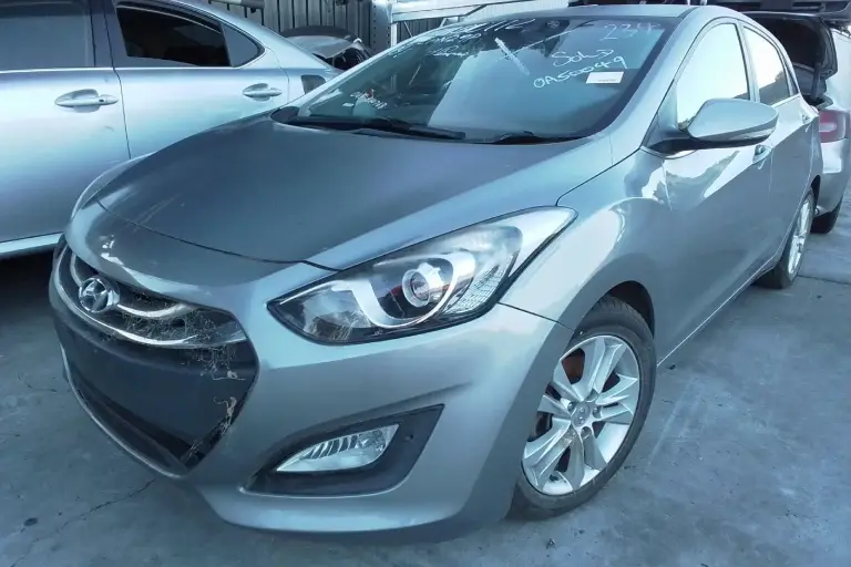 Damaged old car in Melbourne showing front bumper issues, suitable for scrap car valuation and instant cash buyers.