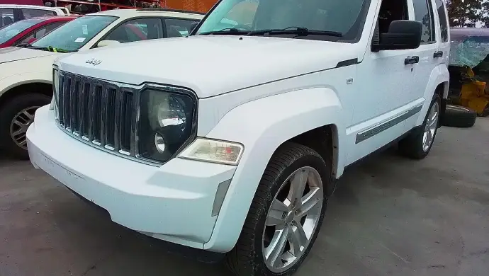 White Jeep SUV parked in Melbourne car removal yard where unwanted vehicles can be sold or recycled for cash.