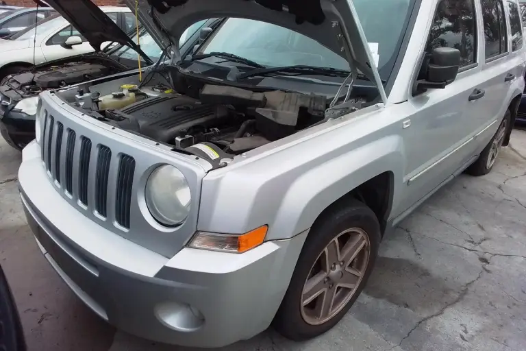 Silver Jeep SUV with engine exposed, considered for trade-in value or cash for cars service in Australia.