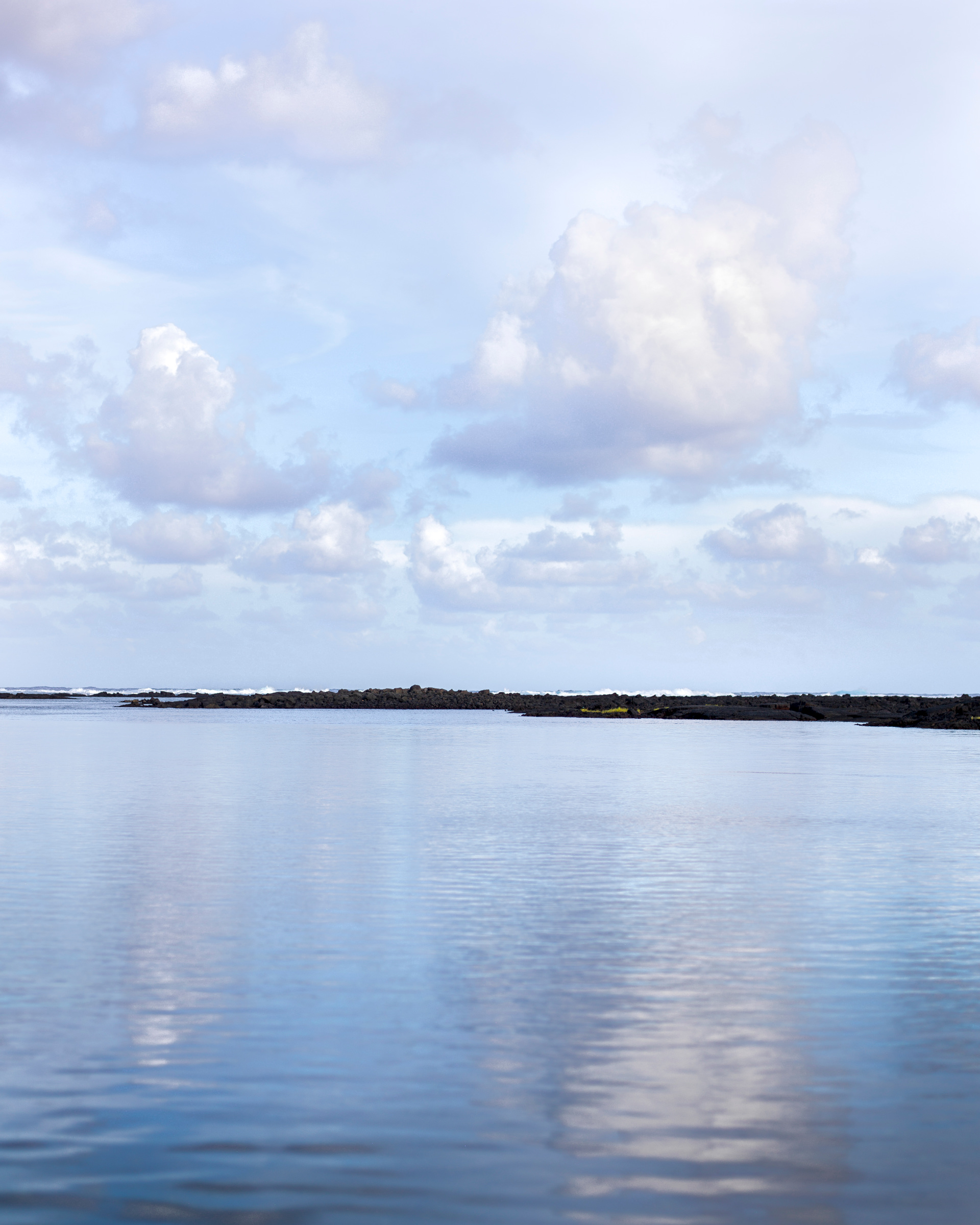 Waiopae in Kapoho with clouds over the ocean.