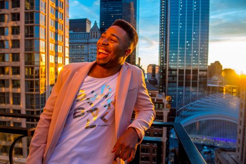 Portrait of a man at sunset overlooking lower Manhattan in New York City