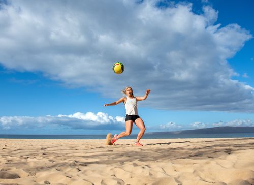 Mikaela Shiffrin playing soccer on the beach on the island of Maui, Hawaiʻi