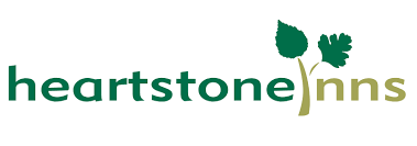 Heartstone Inns logo with green and gold text and two stylized green leaves above the letters 'inns'.