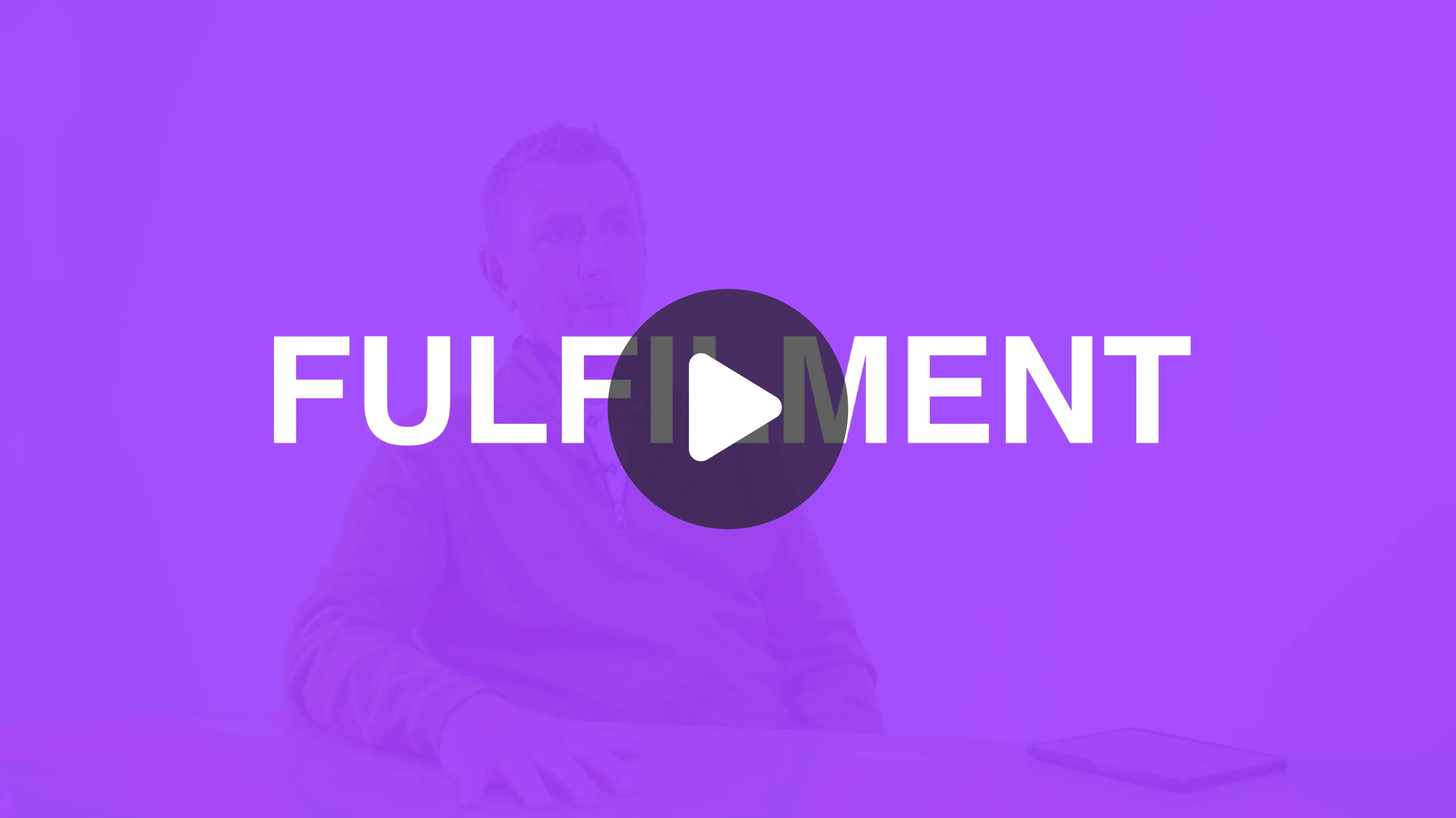 Video thumbnail showing a man seated at a table with a tablet device to his right and the word 'FULFILLMENT' overlaid, with a play button icon in the center.