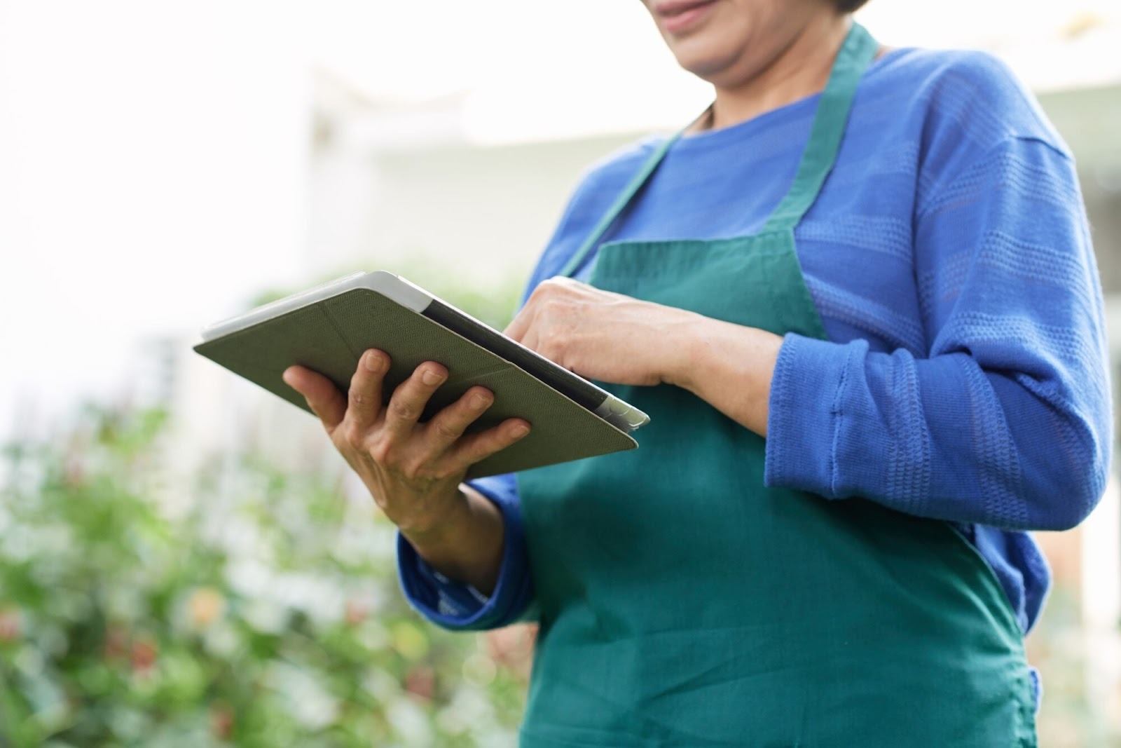 Food technician using a tablet