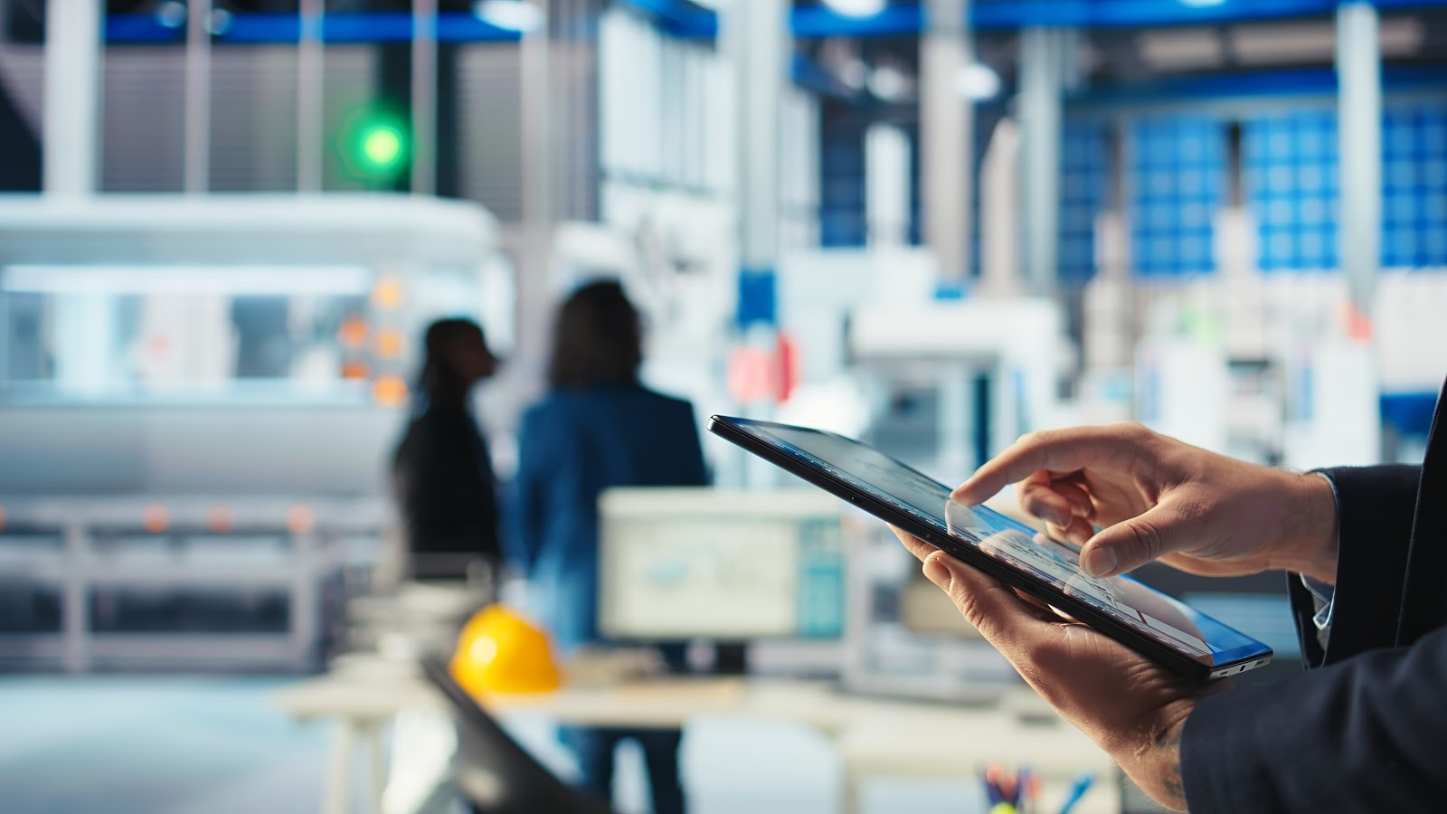 Close up of inspector using a tablet for facility inspections