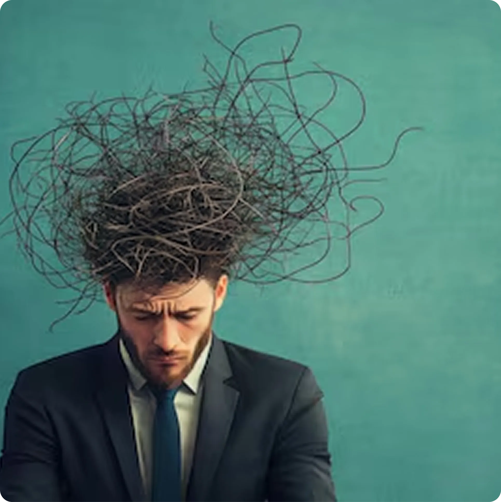 Man in a suit with tangled, swirling hair resembling chaotic lines above his head against a teal background.