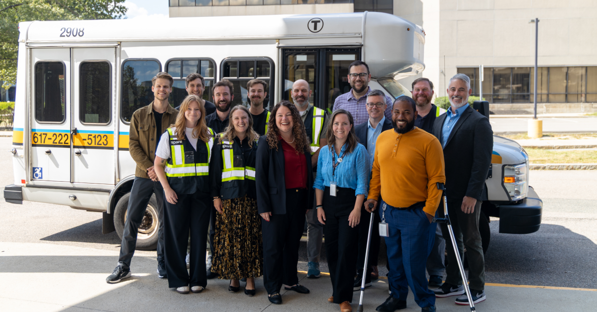 The Spare team with MBTA posing in front of a paratransit vehicle