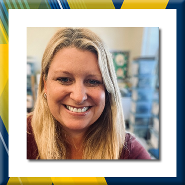 Colleen Jaffe smiling in a classroom setting