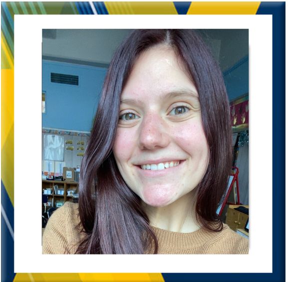Kathryn Benatti smiling in a school classroom setting