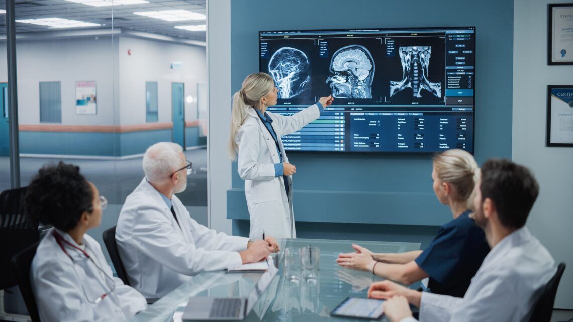 Group of radiologists are viewing MRI images with PACS System for hospital