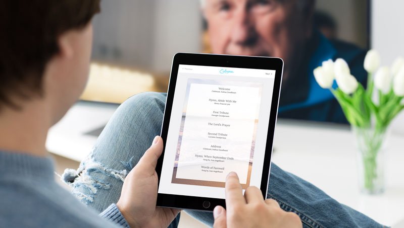 Digital Order-of-service program displayed on a tablet during a live-streamed funeral