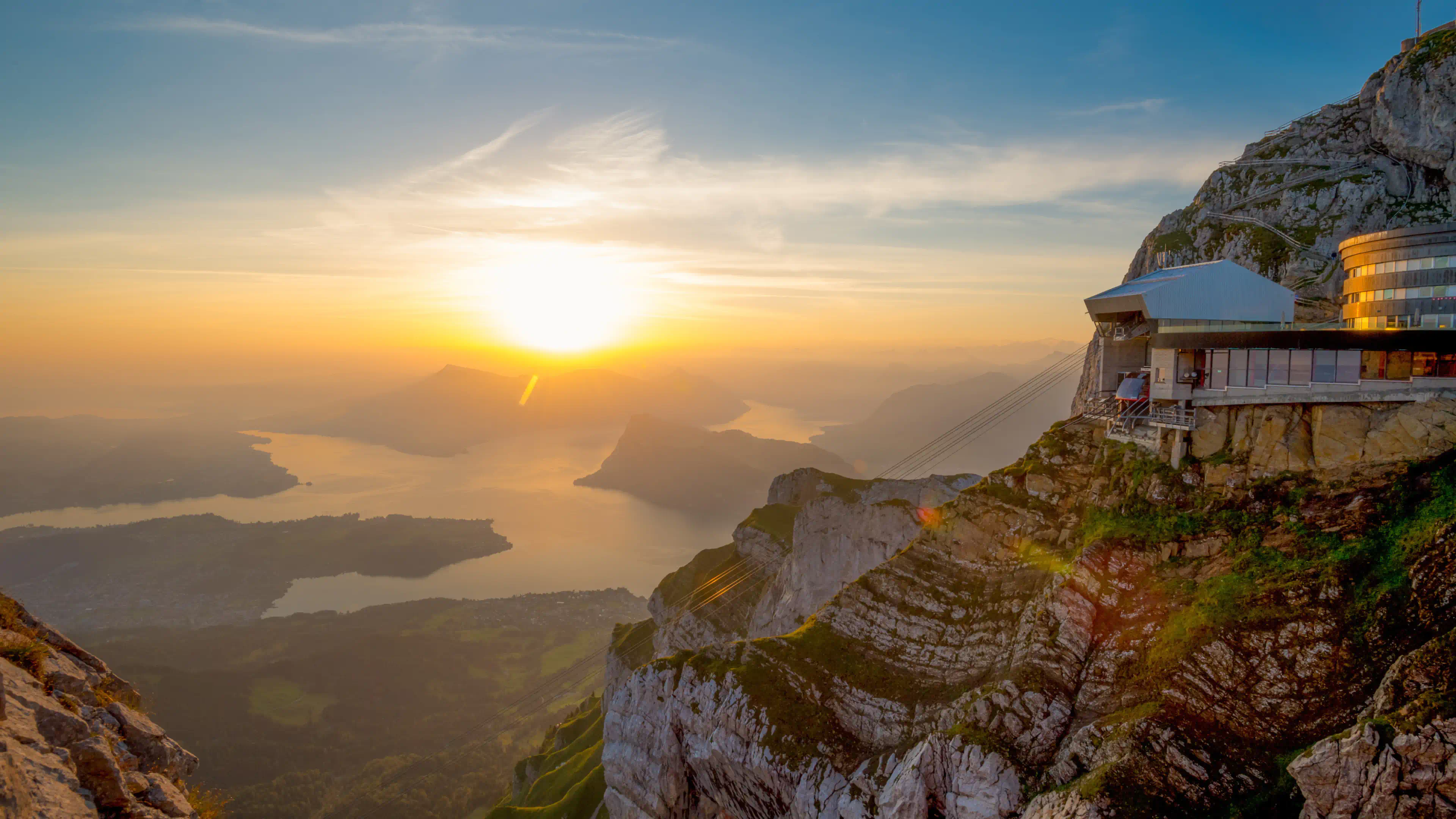 The sun is setting over a mountain top.