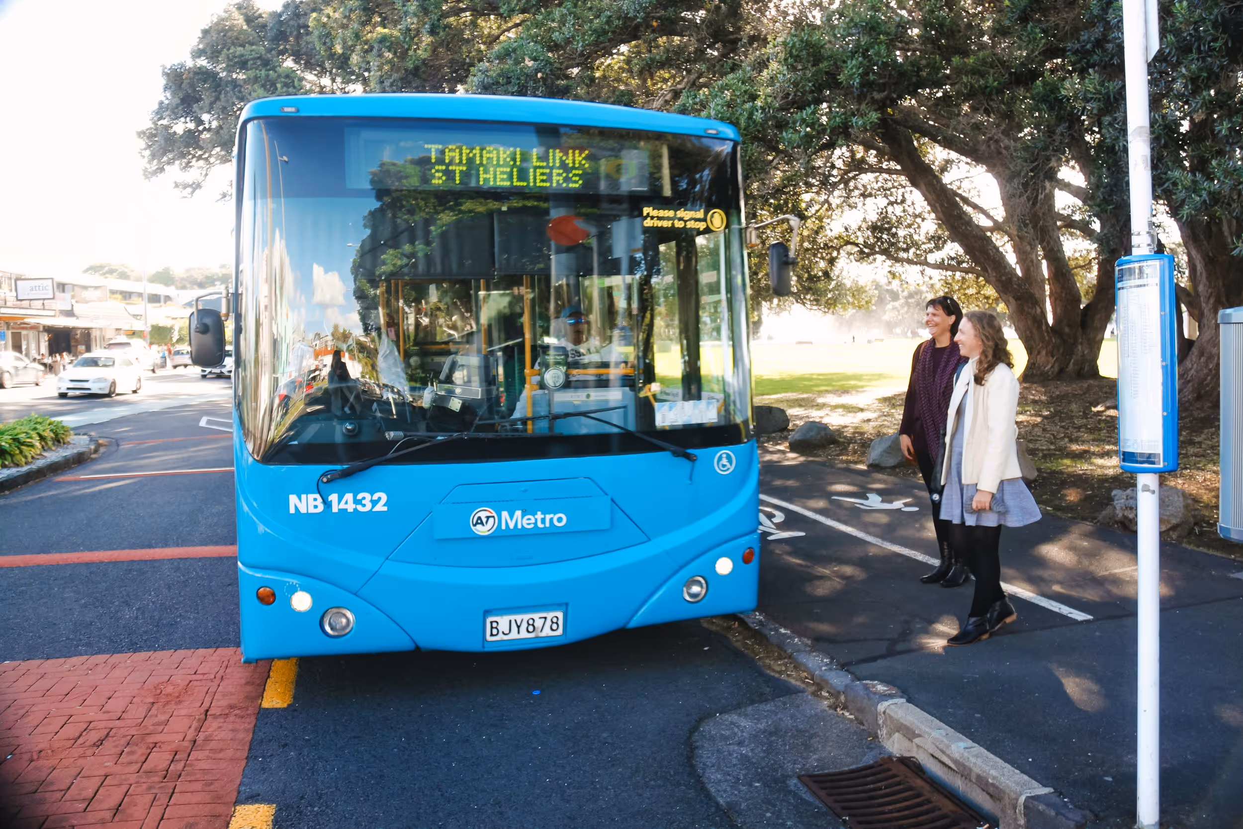 A photo of the front of a blue bus